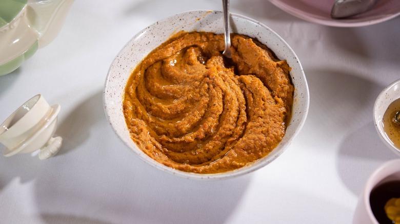 Carrot dip in white bowl