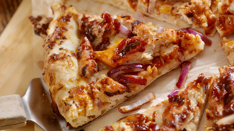 BBQ chicken pizza slice with metal spatula