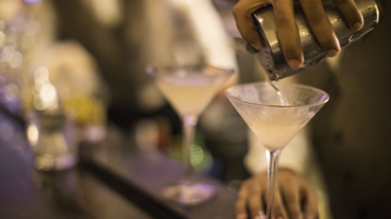 Pouring martini into glass