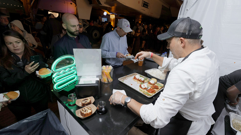 Shake Shack worker assembling sandwiches