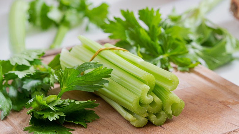 Celery stalks on cutting board