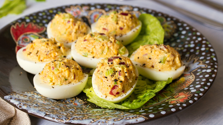 deviled eggs with seasoning and chives