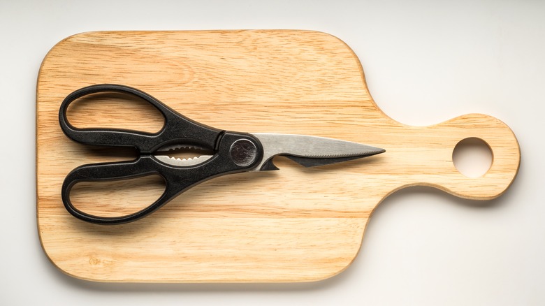 kitchen shears on cutting board