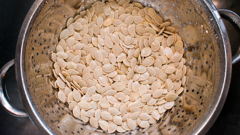 Pumpkin seeds in colander 