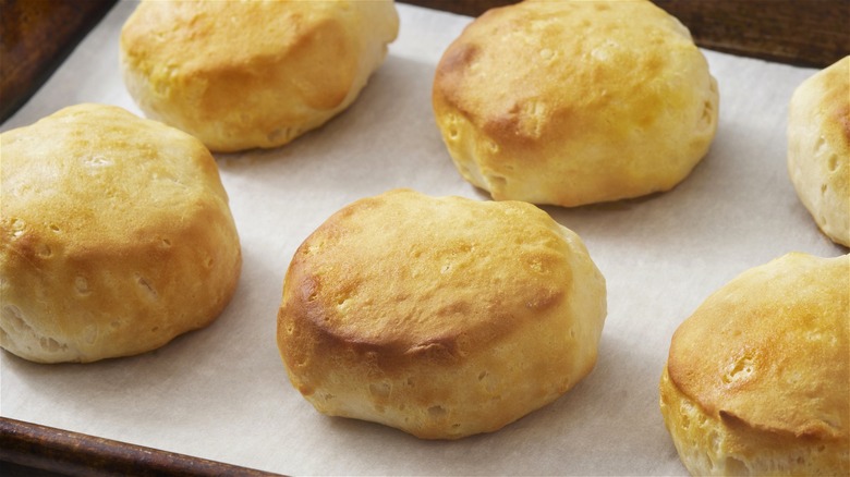 Baked canned biscuits on baking sheet 