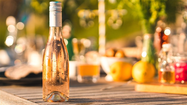 Bottle of rosé wine on table 