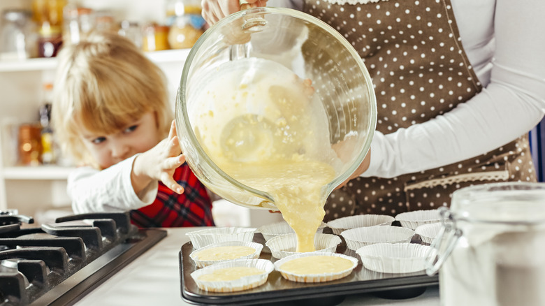 Mum and daughter making cupcakes