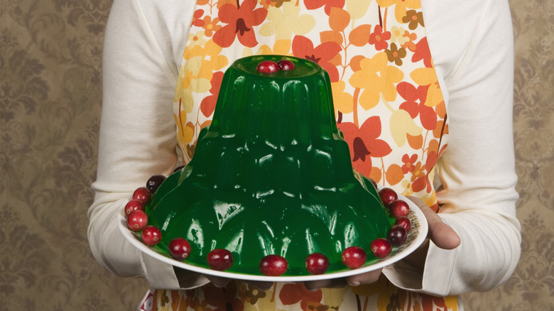 Woman holding green Jell-O mold