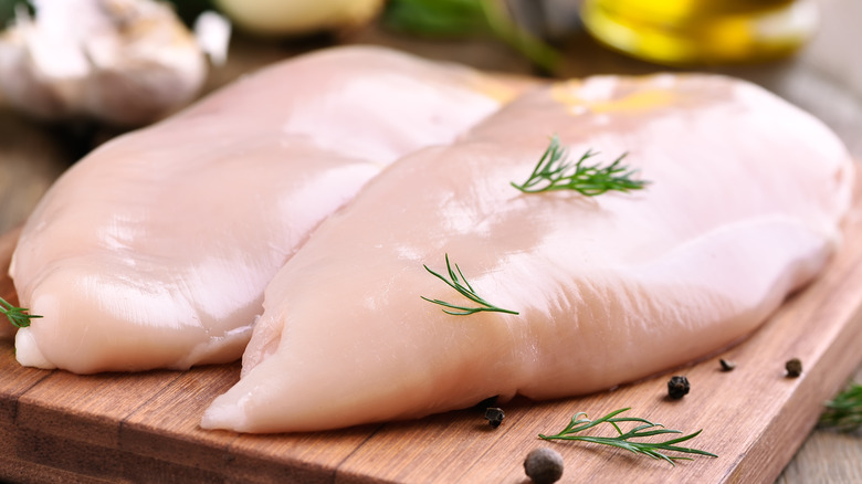 two raw chicken breasts