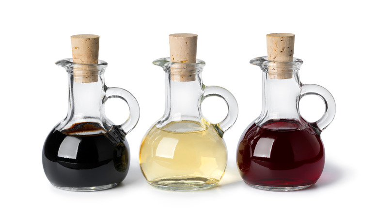 Cruets of  different colored vinegars