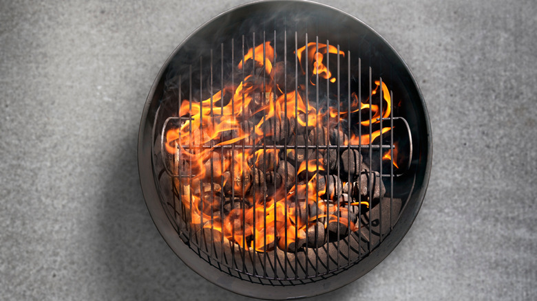 flaming charcoal grill from above