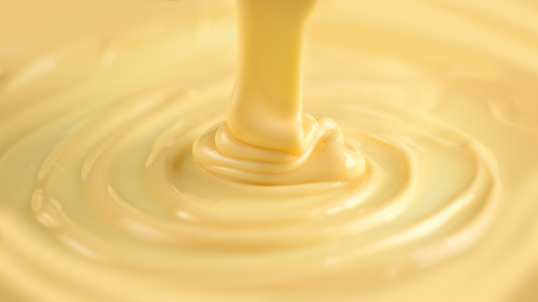 Pouring melted white chocolate