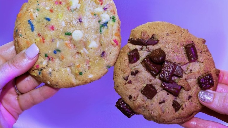 Two Insomnia cookies: confetti and chocolate chunk