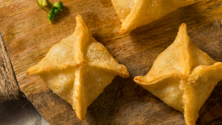 crab rangoon on a board