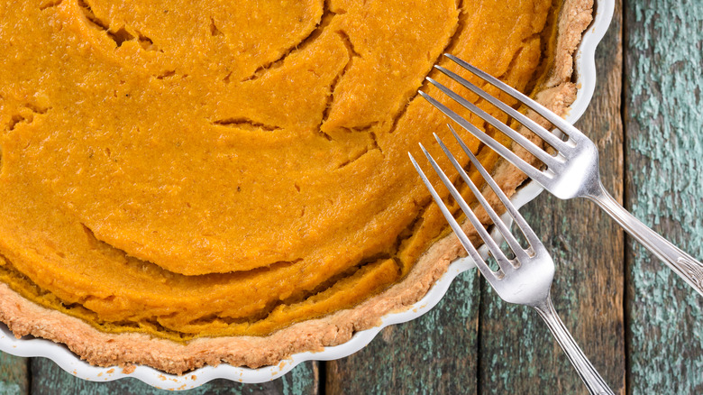 pumpkin pie with forks