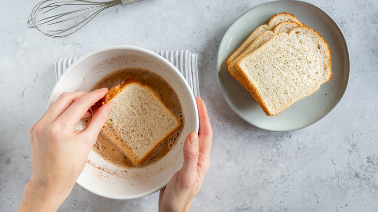 soaking bread in french toast batter