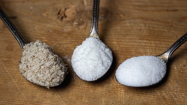 Different types of salt in spoons