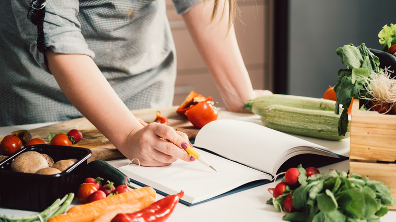 Person writing a recipe