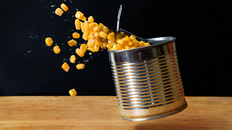 corn exploding from can