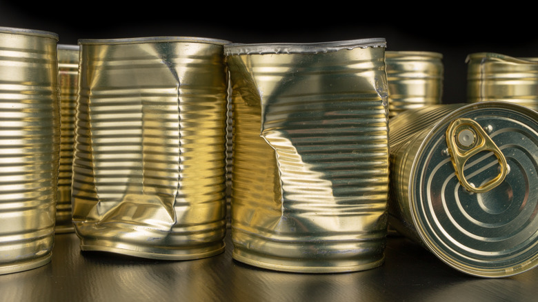 dented tin cans