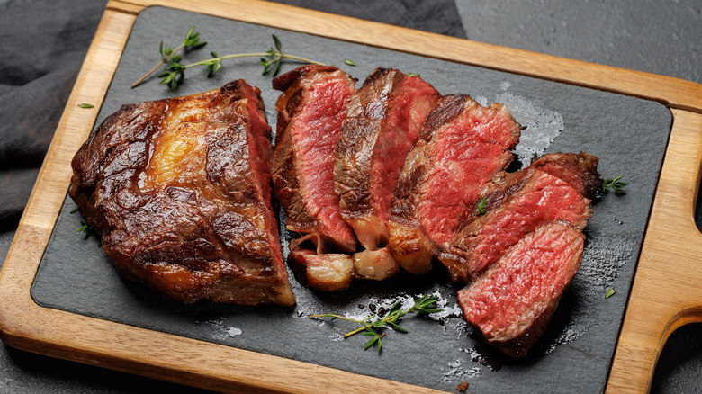 Grilled steak on cutting board