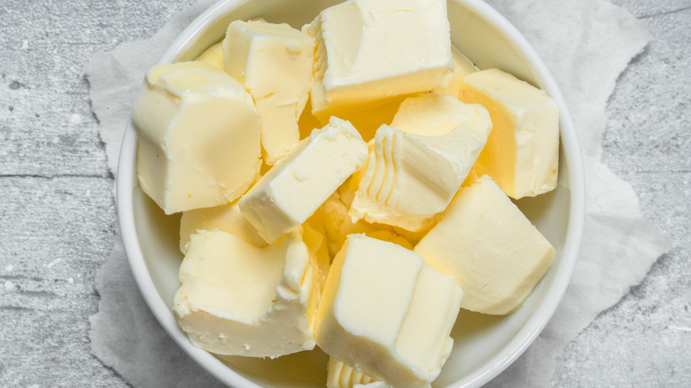 pieces of butter in white bowl