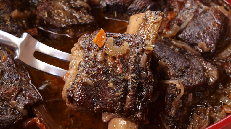 meat braising in a dutch oven