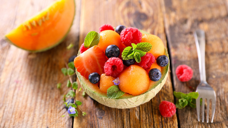 half cantaloupe filled with other fresh fruit