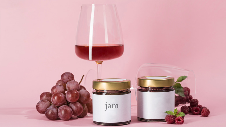 Wine, grapes, and jars of jam