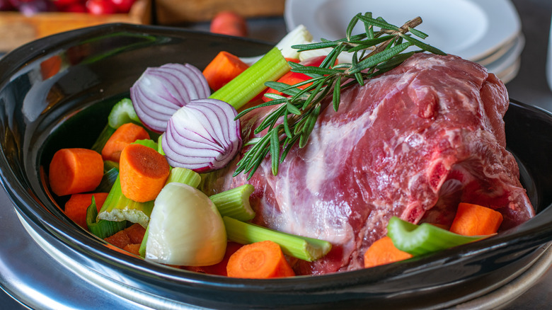 Pork shoulder with vegetables in slow cooker