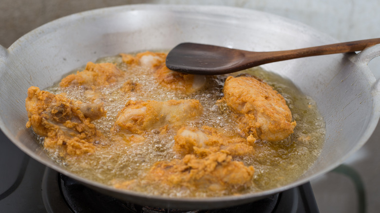 Chicken frying in oil