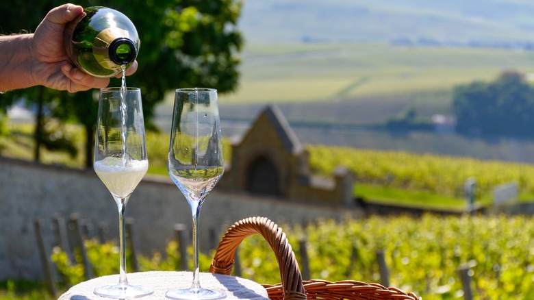 pouring champagne outdoors