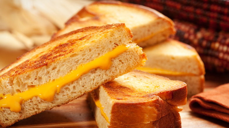 grilled cheeses sitting atop table