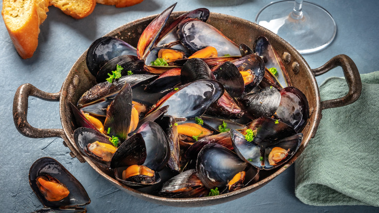 Cooked mussels in a skillet