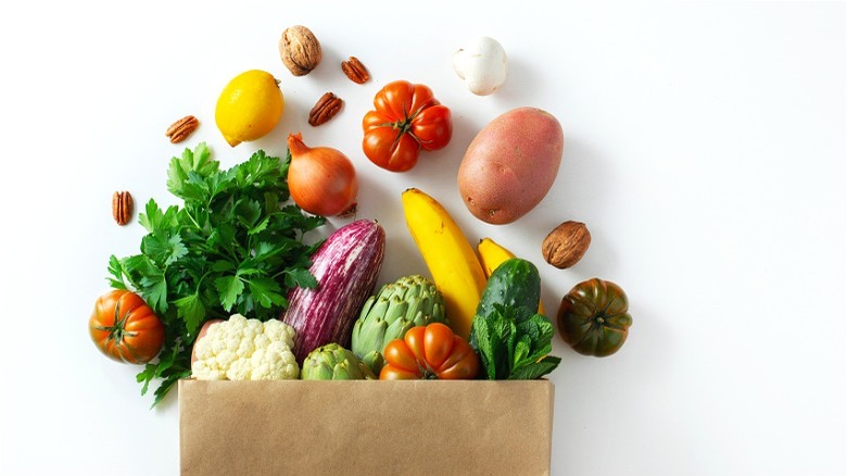 Colorful produce in brown bag