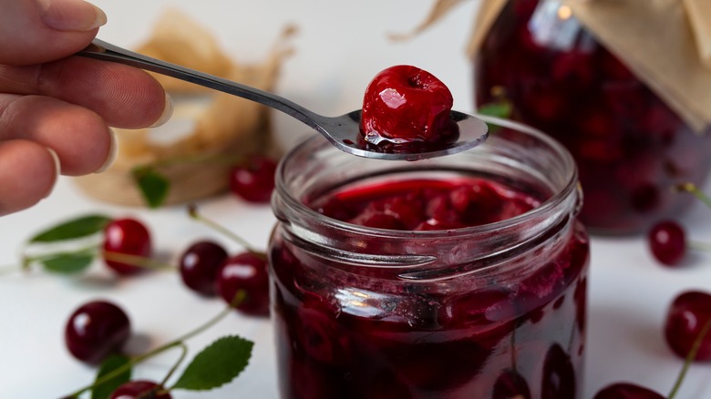 cherry sauce with cherry in spoon