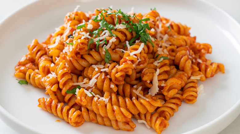 Rotini with sauce on plate