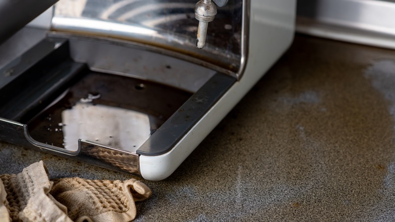 Broken coffee machine leaking liquid