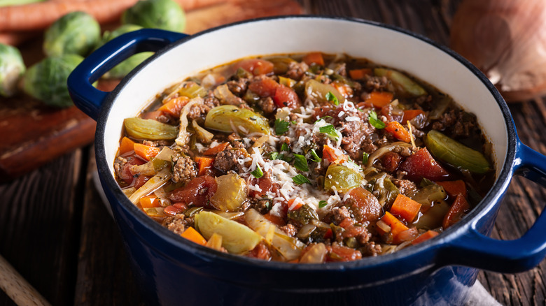 pot of cooked soup containing vegetables