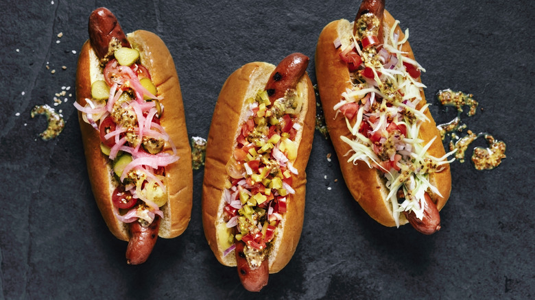 hot dogs with many toppings