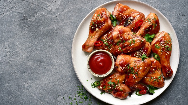 Chicken drumsticks on white background