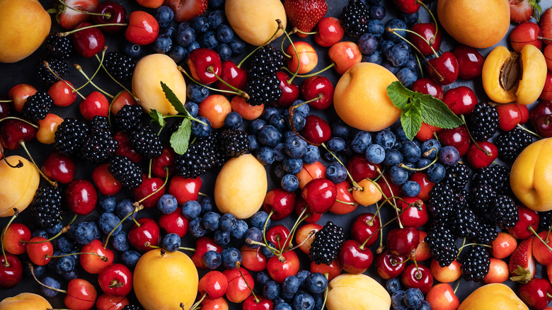 pile of peaches and berries 