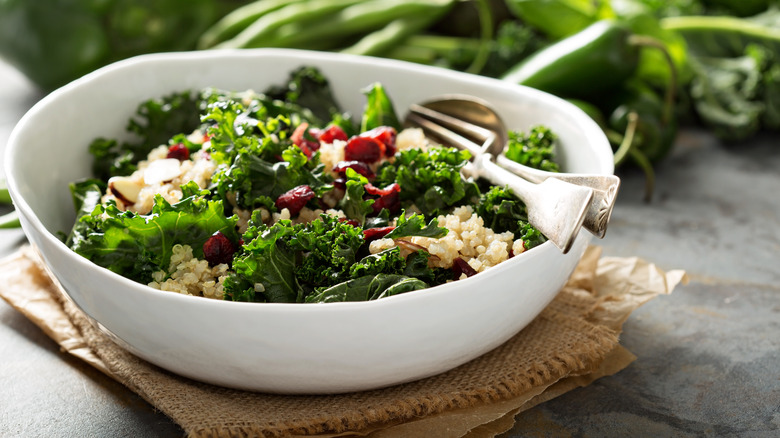 Kale salad in bowl on table