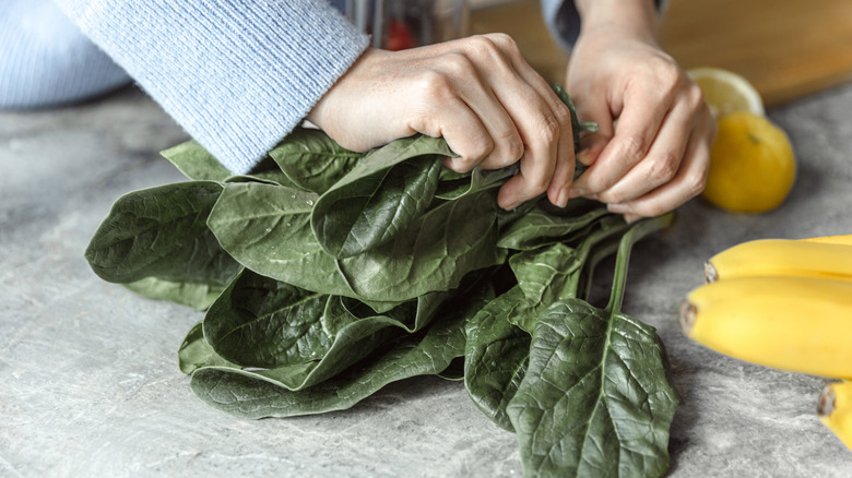 Woman preparing spinach