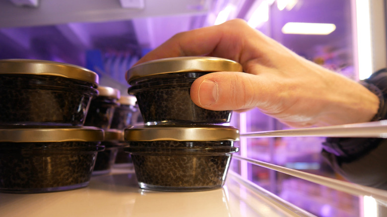 hand reaching for caviar shelf