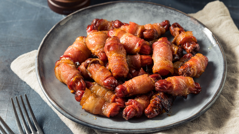 Bacon-wrapped cocktail weenies on a plate