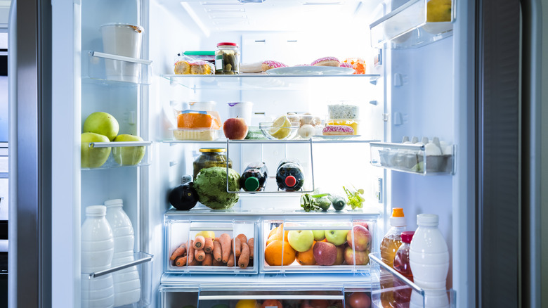 Open refrigerator with food inside