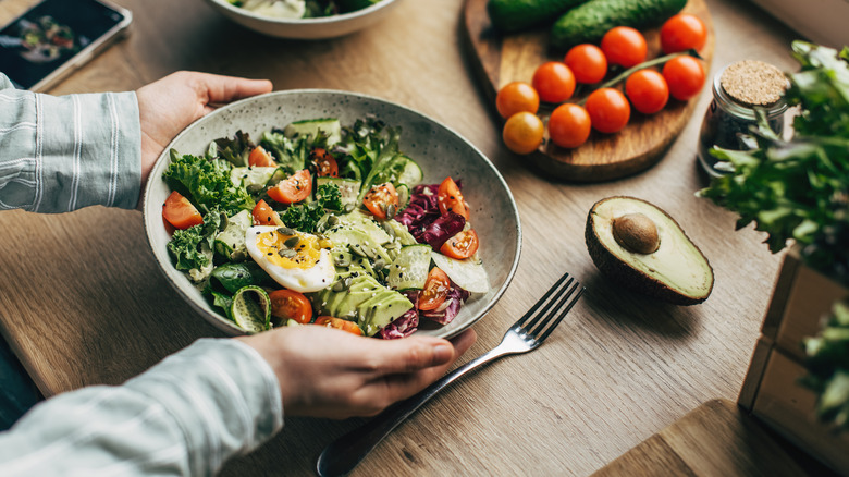 person holding salad