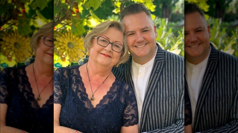 Ross Mathews and his mom smiling outside