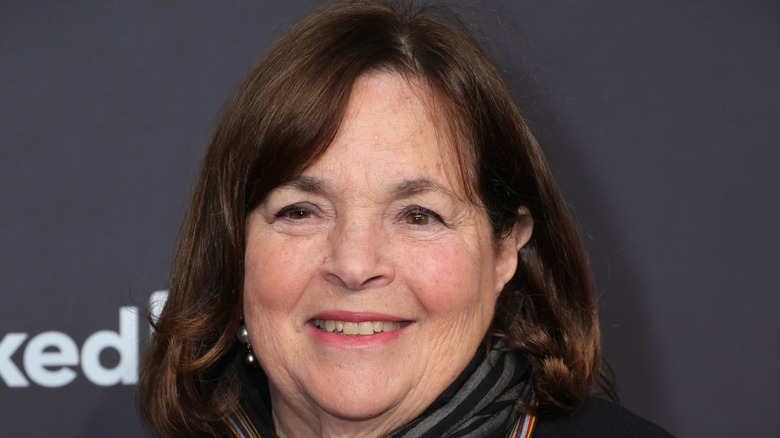 Ina Garten smiling against black backdrop